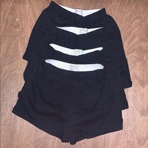 4 pairs of black Soffe shorts